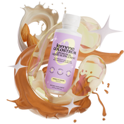 Lemme Colostrum supplement bottle with liquid splashes on a white background