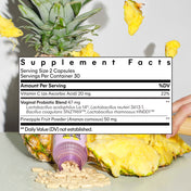 Supplement facts label with pineapple and capsules on a light gray background
