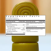 Supplement facts label on a green gummy vitamin with a blurred background