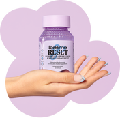 Hand holding a bottle of 'lemme RESET' supplement with a purple background