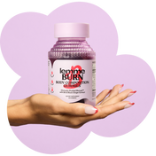Hand holding a bottle of 'lemme BURN' body composition gummies against a purple heart-shaped background